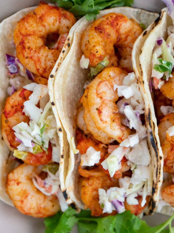 shrimp tacos with slaw on plate