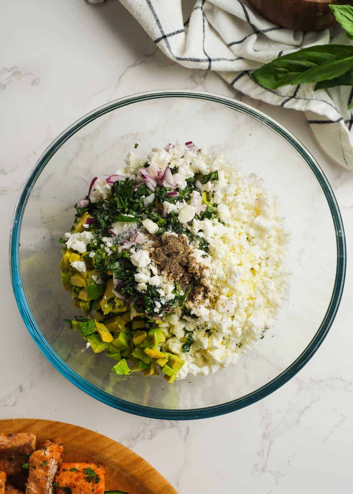 ingredients for avocado feta dip in a bowl